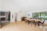 Dining space featuring high vaulted ceiling, light wood-style flooring, and recessed lighting