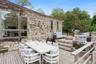 Deck featuring outdoor dining area, a grill, and an outdoor hangout area