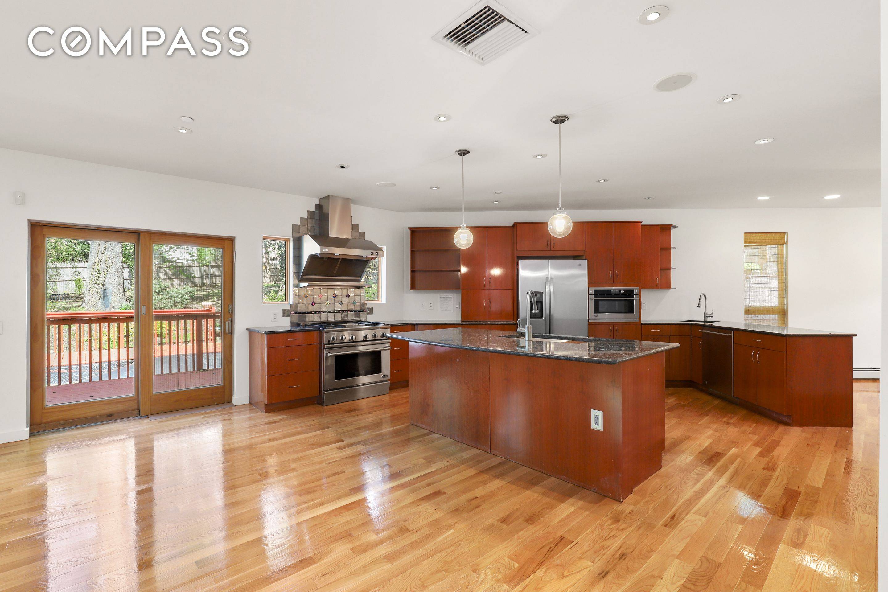 Modern Contemporary home that features 5 Bedroom, 4 full and 2 half bathrooms and is located just 15 minutes from Mid Town Manhattan.