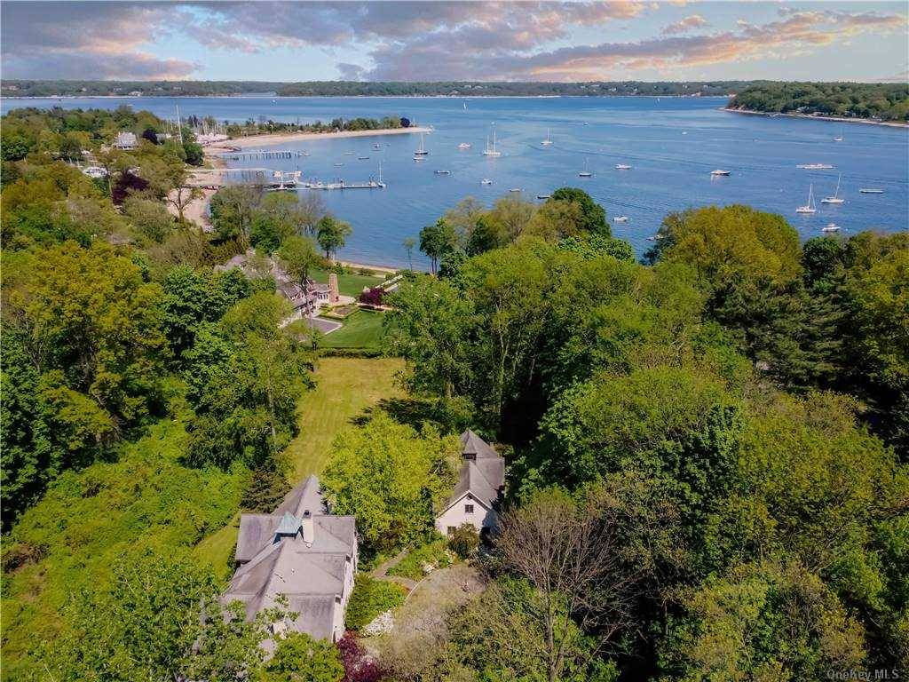Centre Island. Welcome to this English Country inspired estate nestled amongst storied Gold Coast homes.