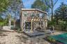 Rear view of house featuring a fenced backyard and a deck