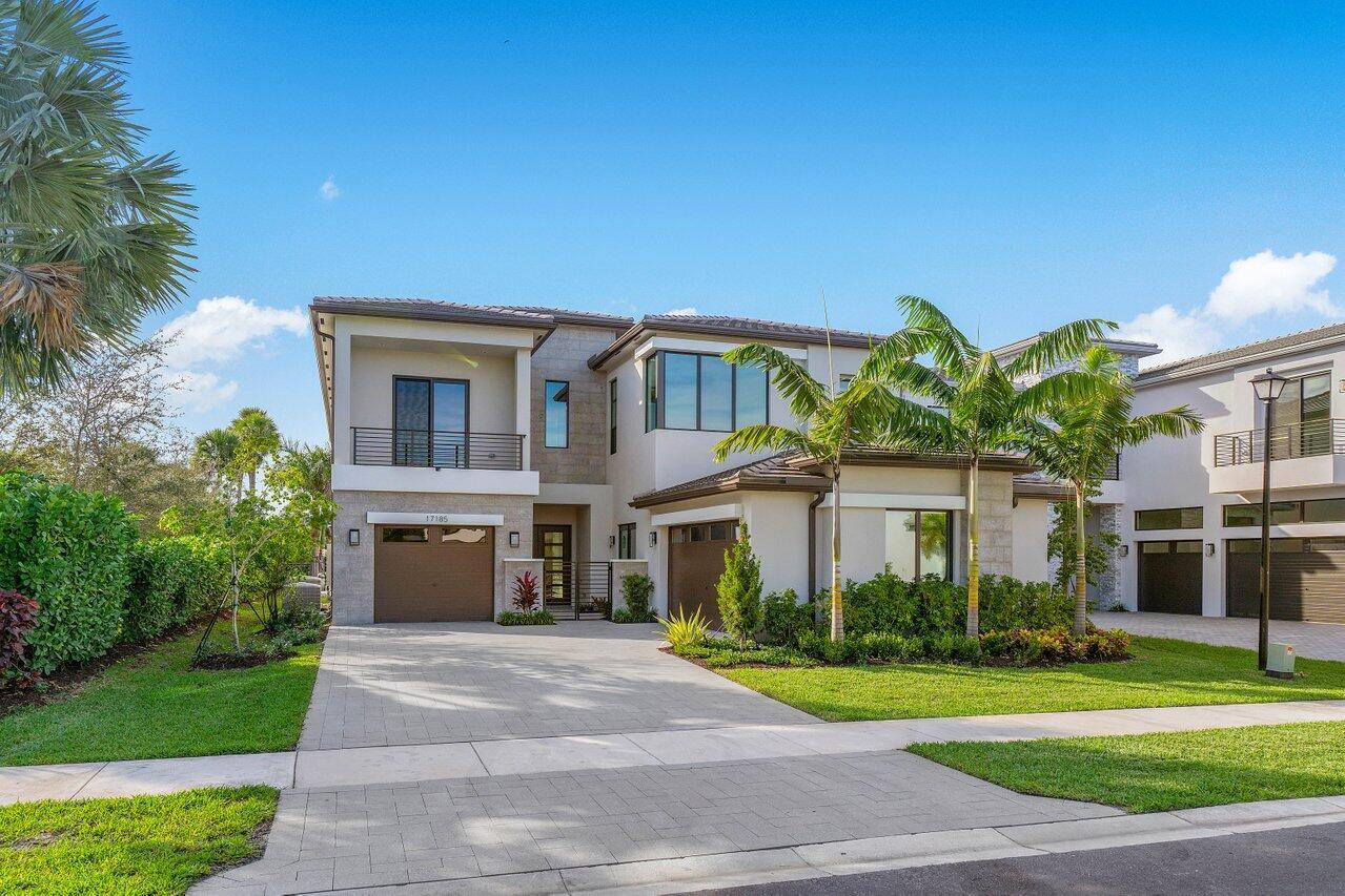 Experience the epitome of sophistication and modern living in this two story residence within the coveted Boca Bridges community.