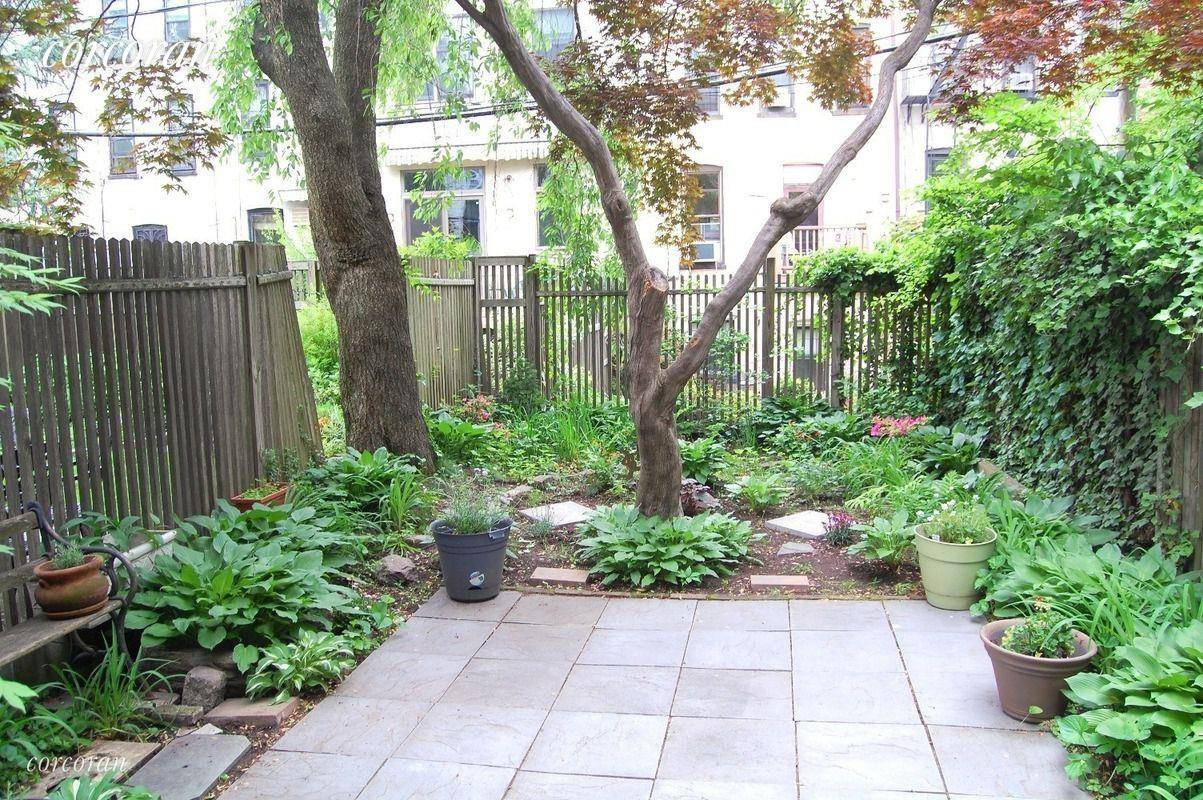 Classic Park Slope Townhouse living with a beautiful deck and backyard.