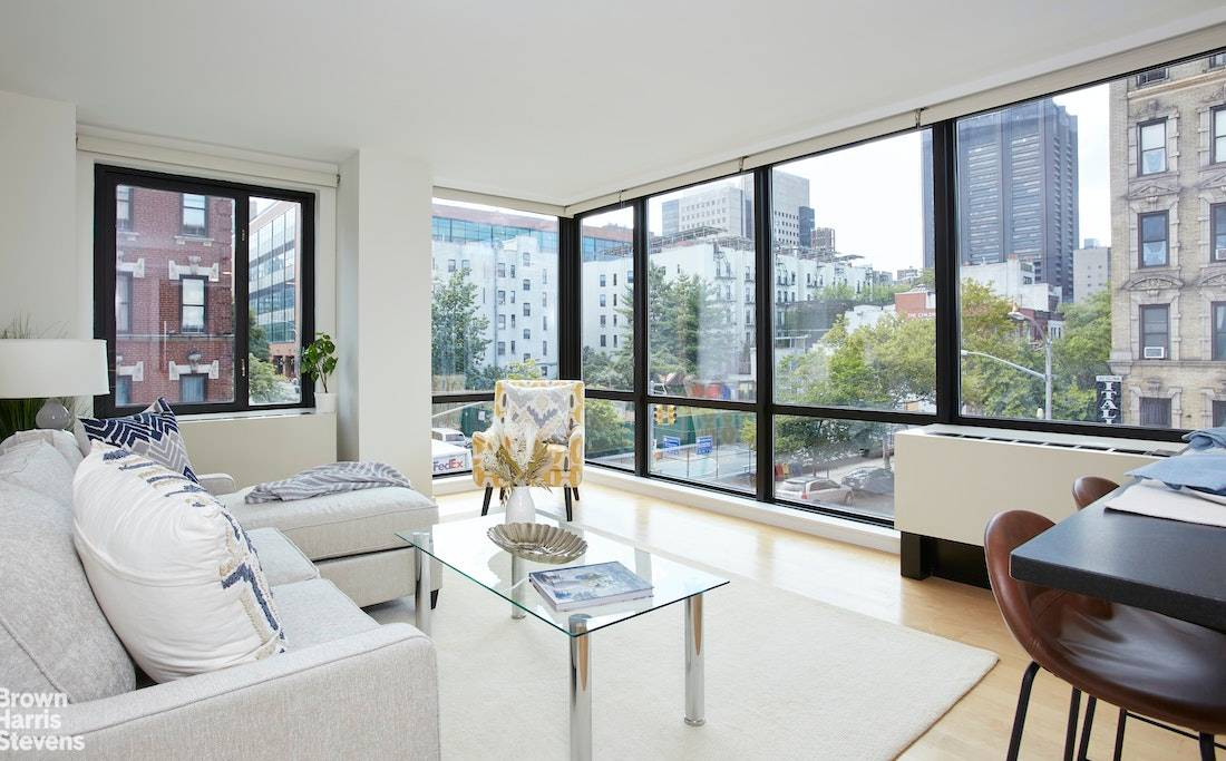 This open and airy corner two bed, two bathroom apartment faces South and West.