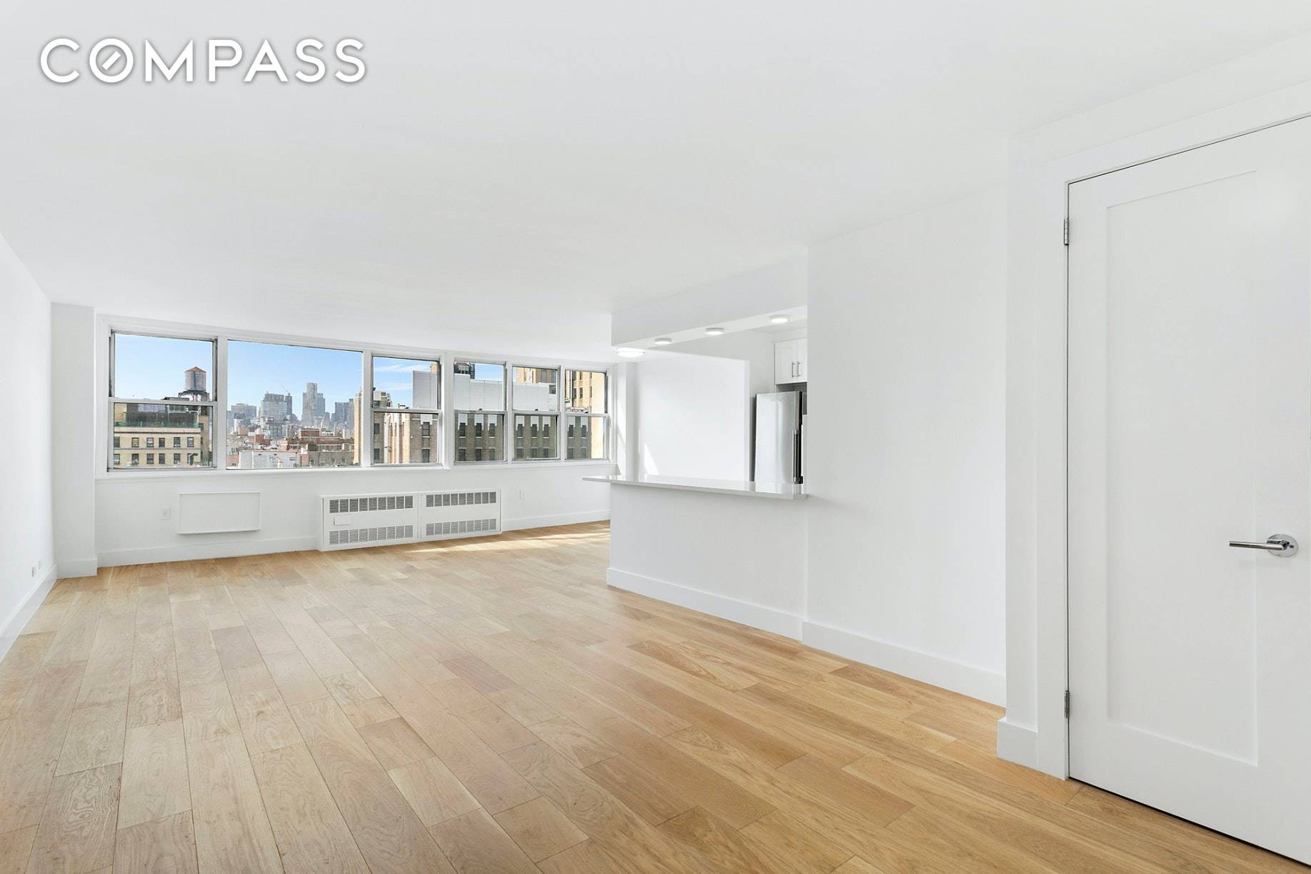 UNBEATABLE VALUE ! Enjoy spectacular, unobstructed, lower Manhattan skyline views, from over 20' wide, south facing wall of windows.