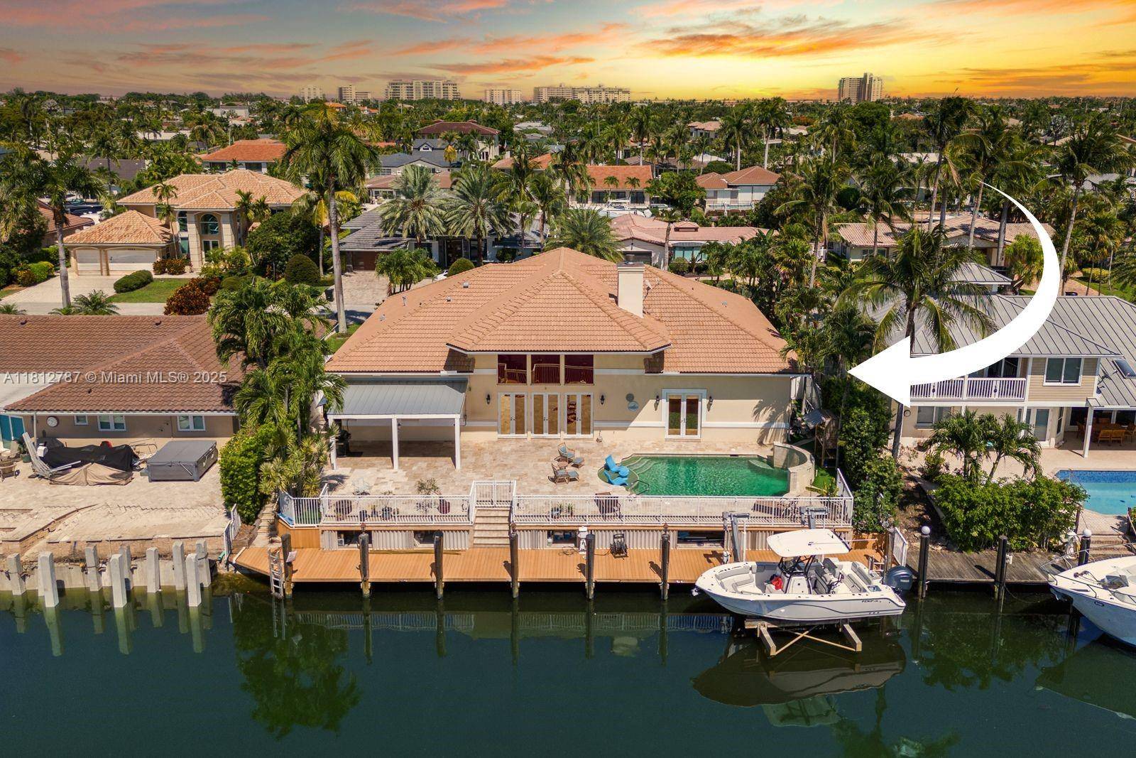 Experience water front luxury in Venetian Isles with this 4 bed, 3.