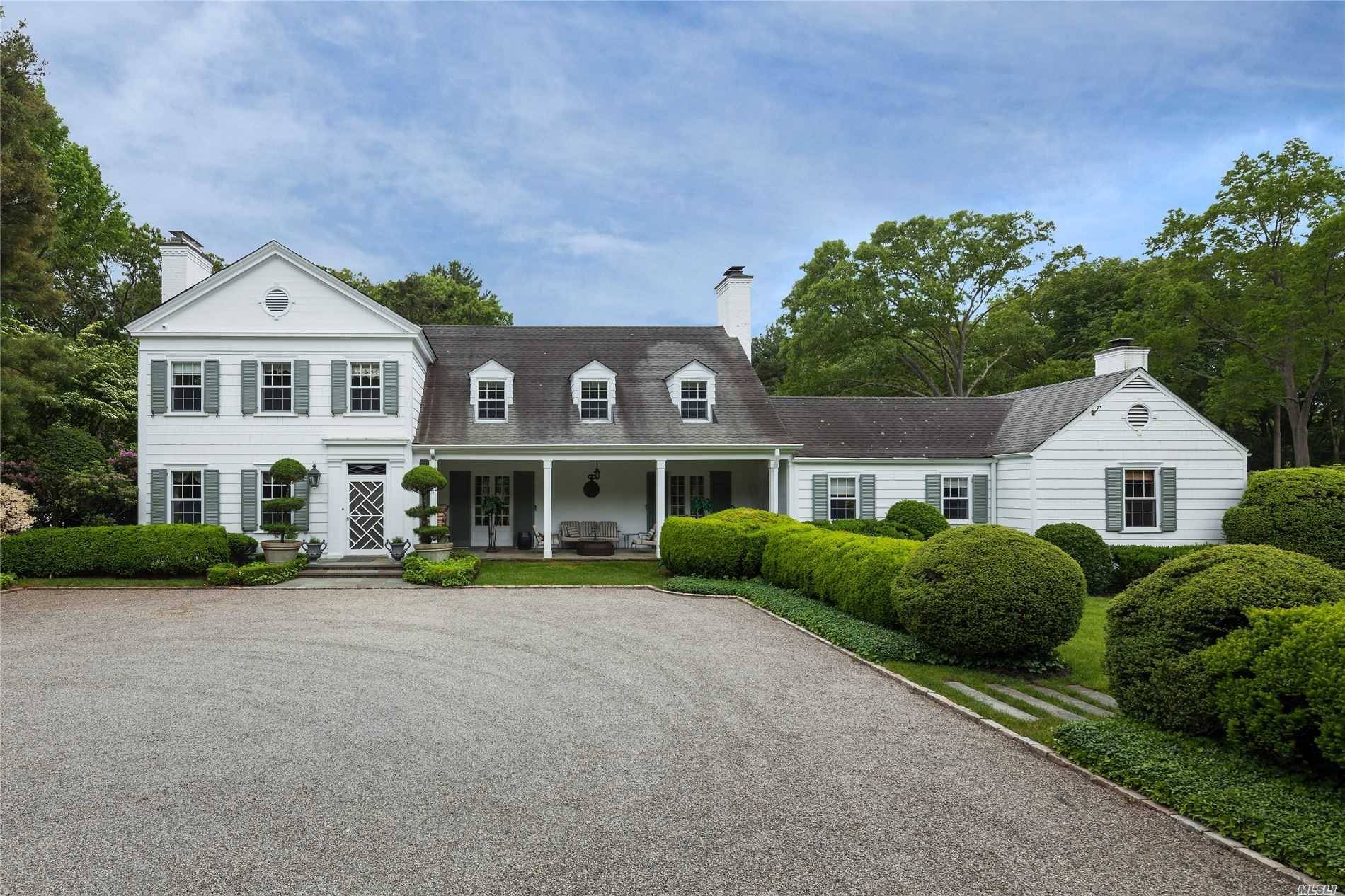 Quintessential country estate on over six acres in the heart of Matinecock.