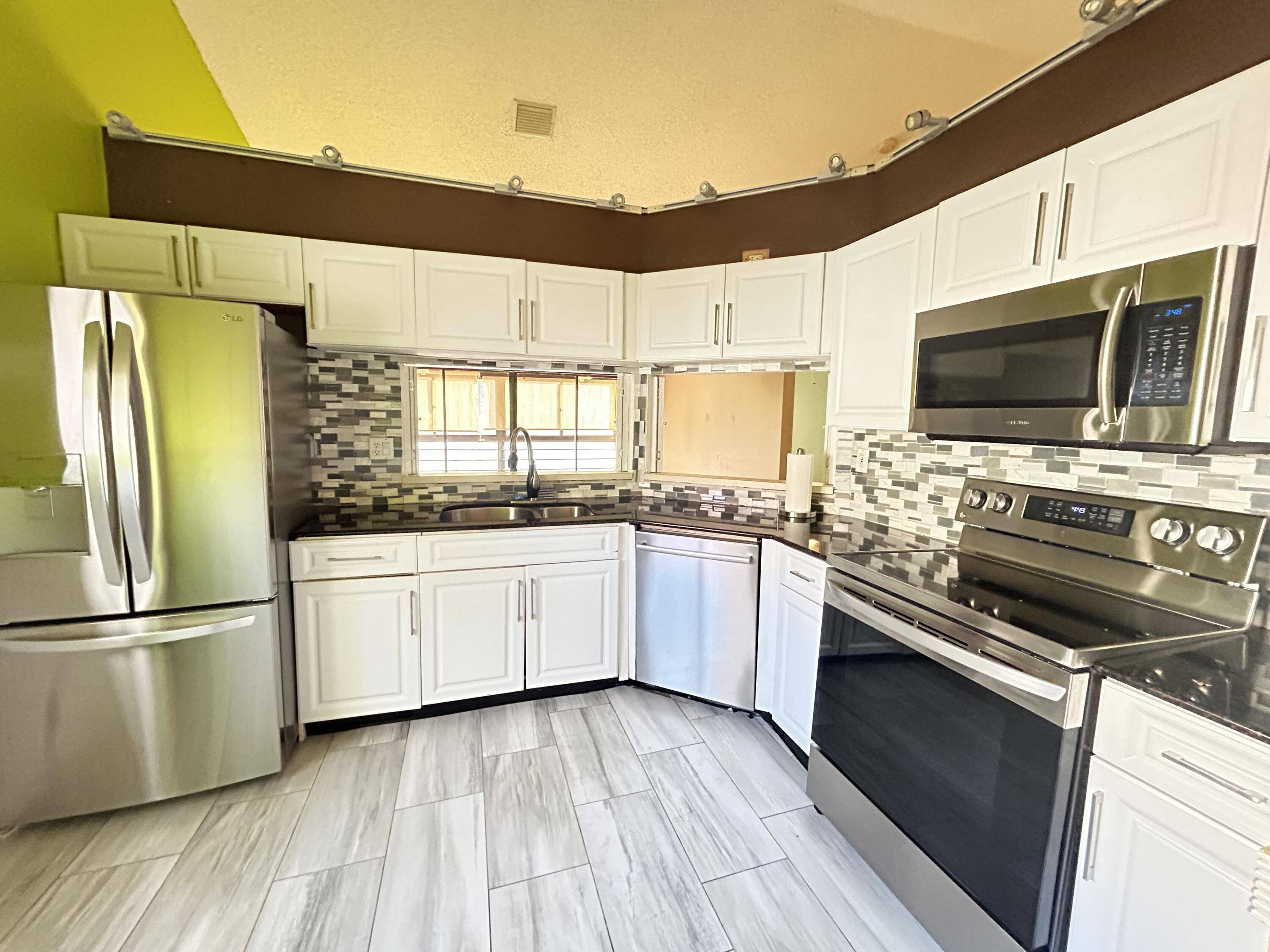 This 3 bed, 2 bath condo with 1 Car Garage, where vaulted ceilings and a glass enclosed Florida room create a serene, treehouse like retreat.