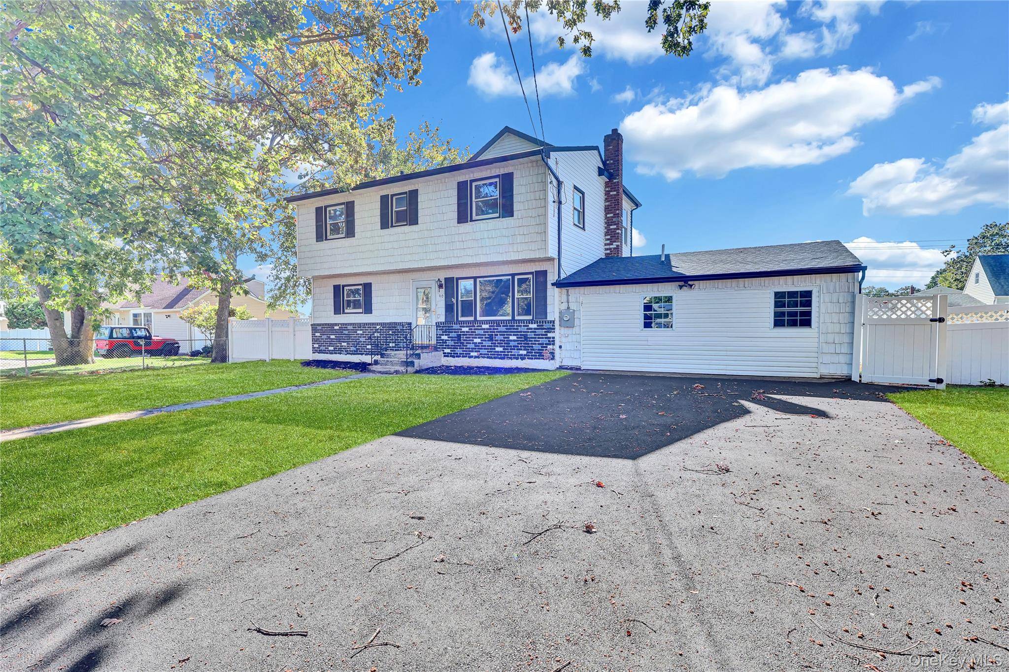 Split level style home featuring 5 bedrooms, 2 full baths, formal dining room, and an eat in kitchen on a dead end street.