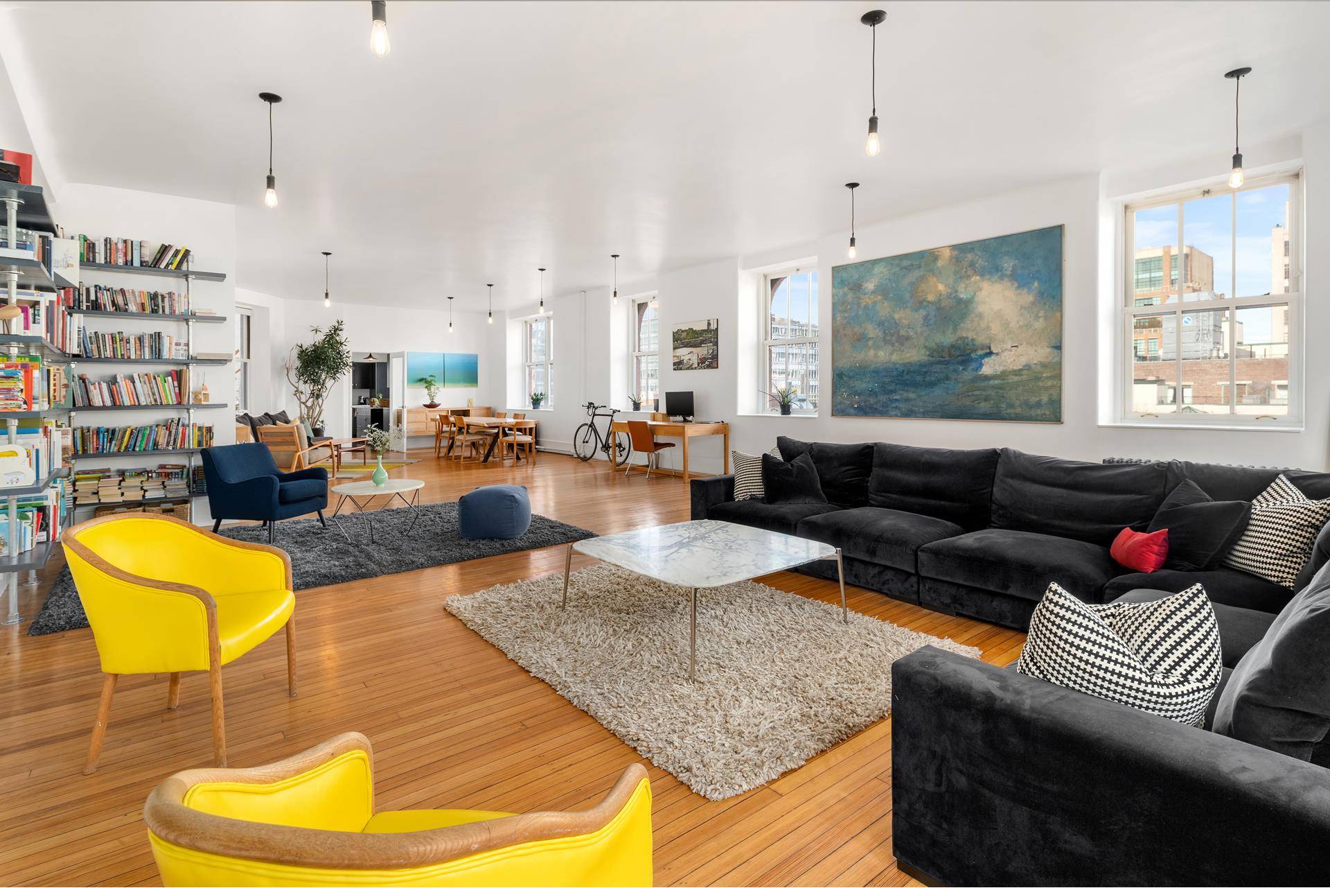 This sun filled and sprawling 2, 880 square foot four bedroom, Tribeca loft offers four exposures through its 28 oversized double hung windows and fabulous city views in every direction.