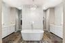 Polished Ceramic tile floor with dual linen closets