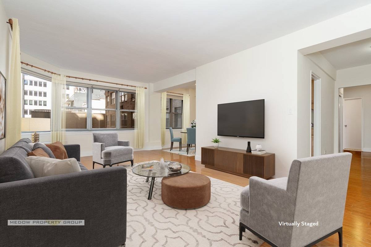 Generous flowing layout in this pristine junior 4 apartment in Murray Hill's premier full service condo.