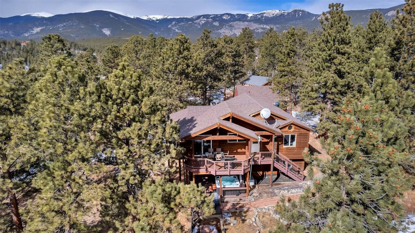 Cozy up in this mountain home and appreciate all the conveniences of warmth and relaxation, whether gathering around the inviting stone fireplace, relaxing in the hot tub or spending a ...