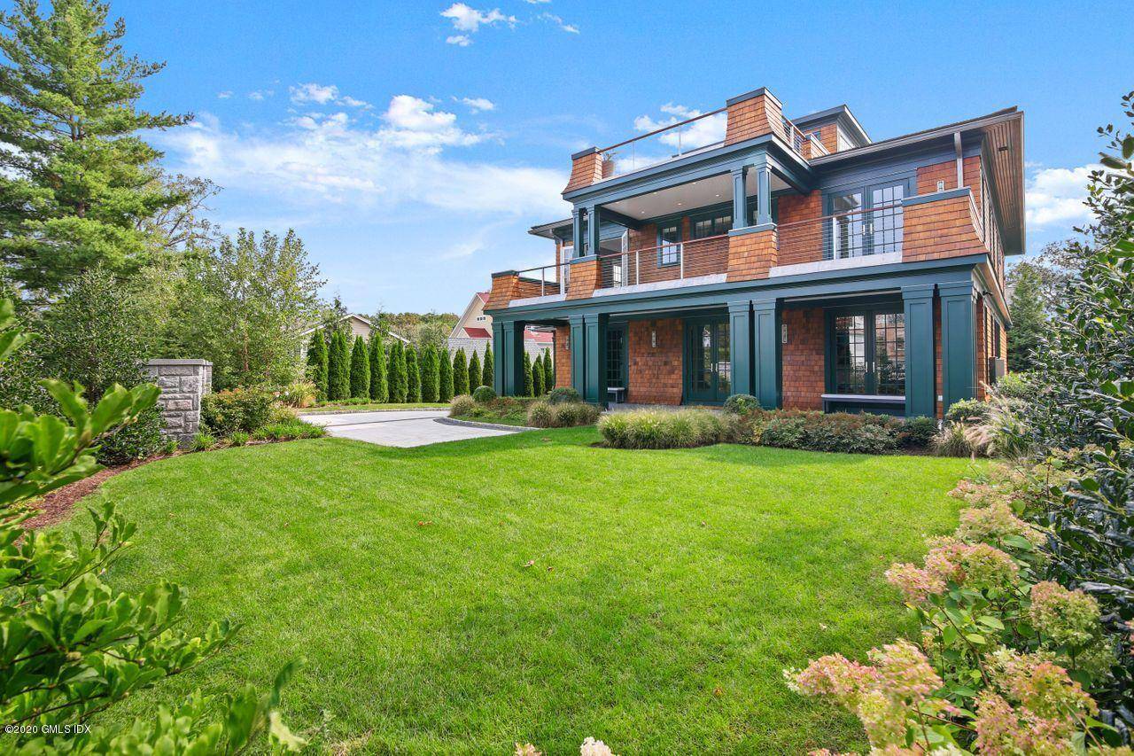 The Wow Factor is here in this 5 bedroom modern conception of a shingle style classic.