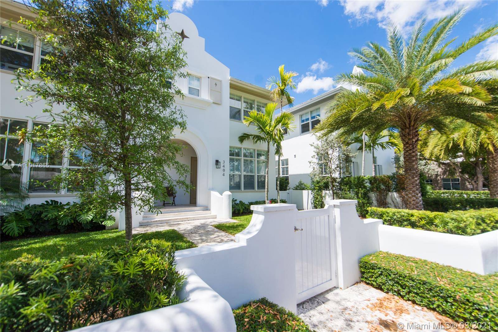 Sophisticated and immaculate, this central Coral Gables townhome is ready to impress.