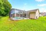 The expansive backyard is perfect for gatherings and weekend barbecues