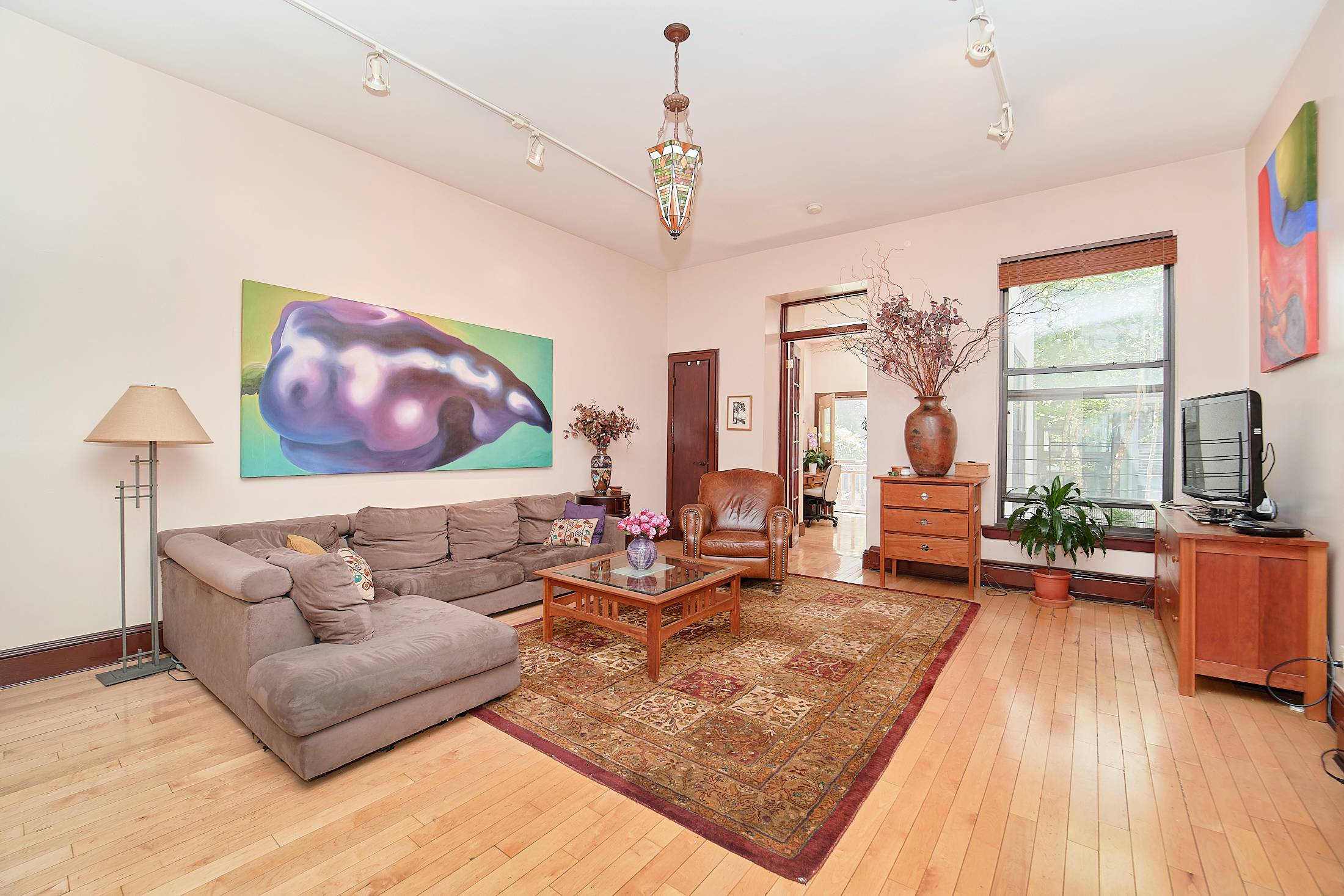 Rarely available brownstone townhouse triplex on one of Harlem's most desirable blocks.