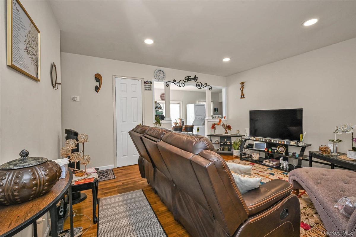 Living area featuring wood finished floors and recessed lighting