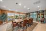 DINING ROOM with 2 full walls of windows that face Lemon Bay, CYPRESS walls, and your private dock, just a stone's throw - room for 10-12 seating easi