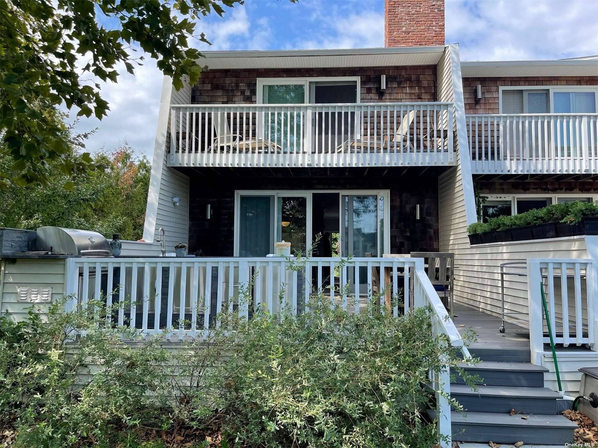 Located in the Village of Westhampton Beach this 1400sf Townhouse offers living room with fireplace, dining area, kitchen, powder room, 2 ensuite bedrooms, full basement, balcony, decking, outside kitchen and ...