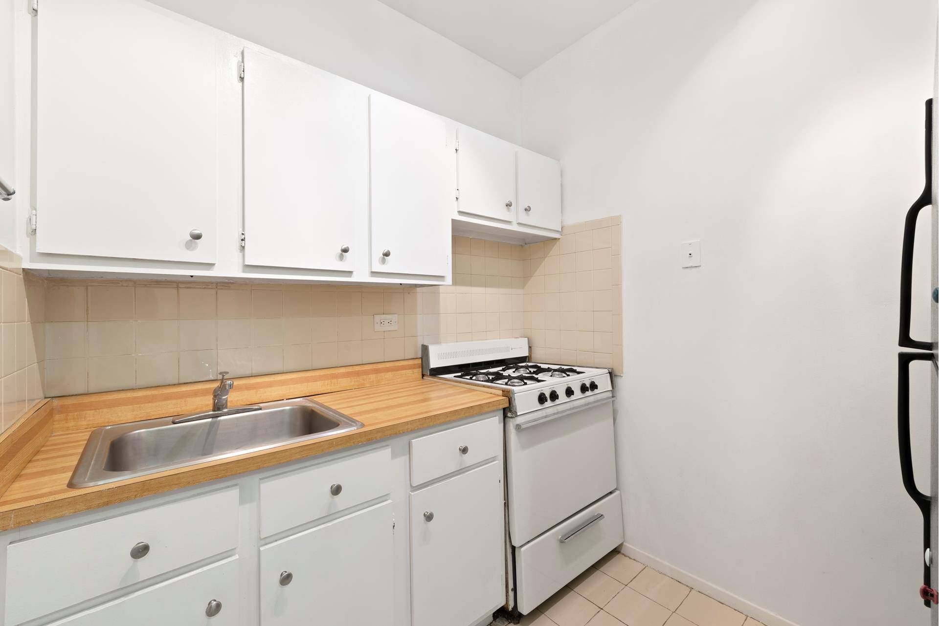 This spacious and bright alcove studio features great views of the East River.