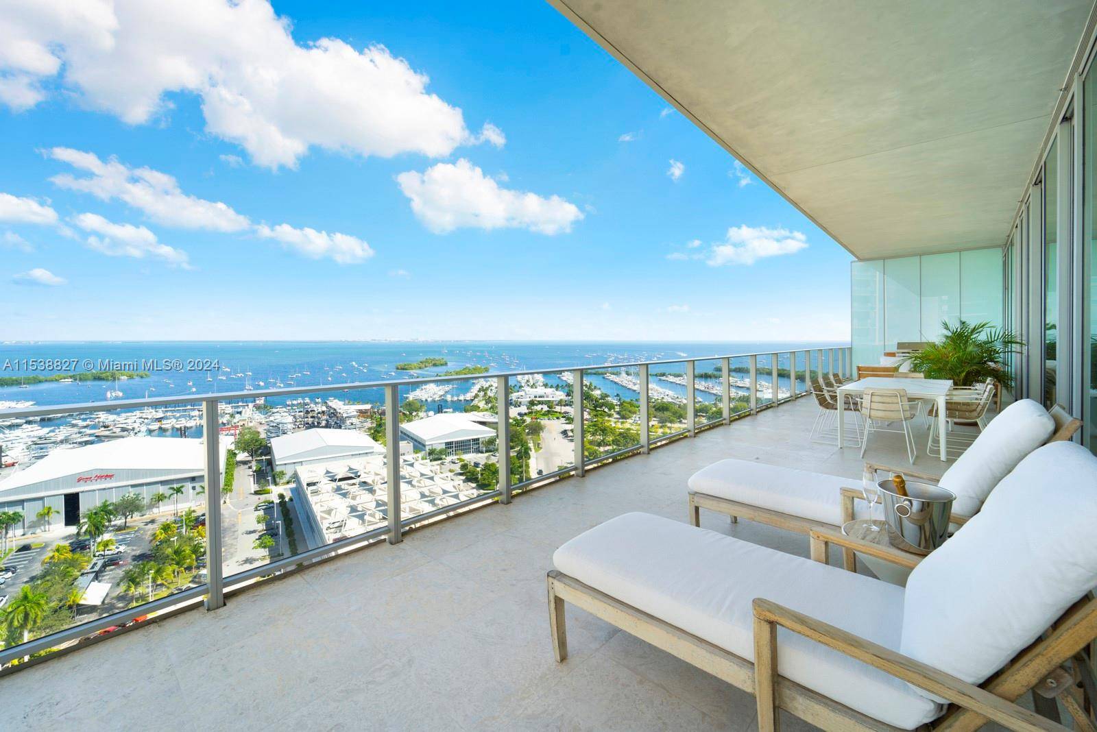 Nestled in the heart of Coconut Grove in the highly sought after Grove at Grand Bay condominium, this 4 BD, 3.