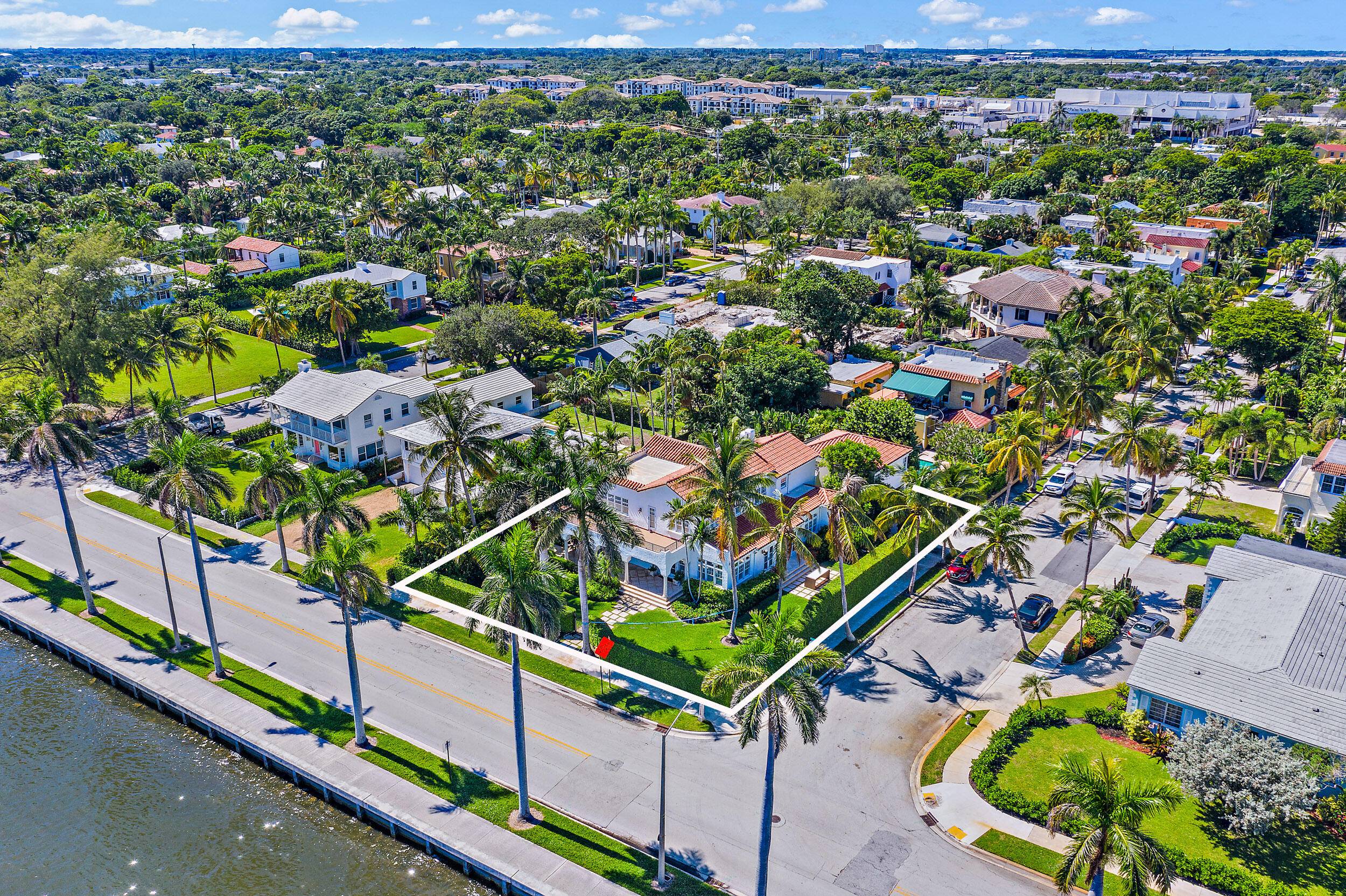 Sumptuous designer living with stunning Palm Beach Waterfront views awaits at this welcoming renovated estate home in West Palm Beach's most prestigious neighborhood, El Cid.