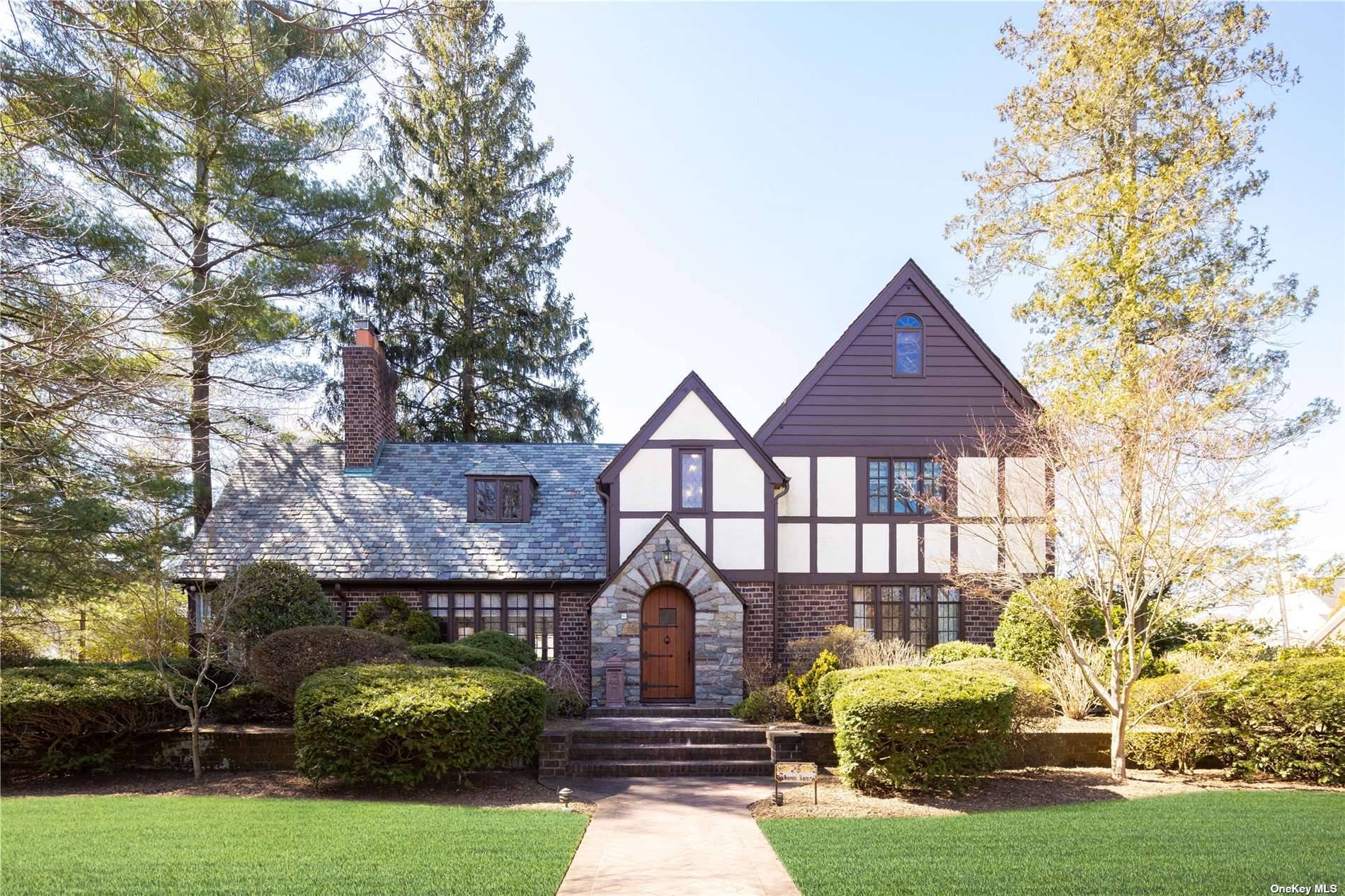 Prepare to be swept away by this stately Tudor with a modern edge.