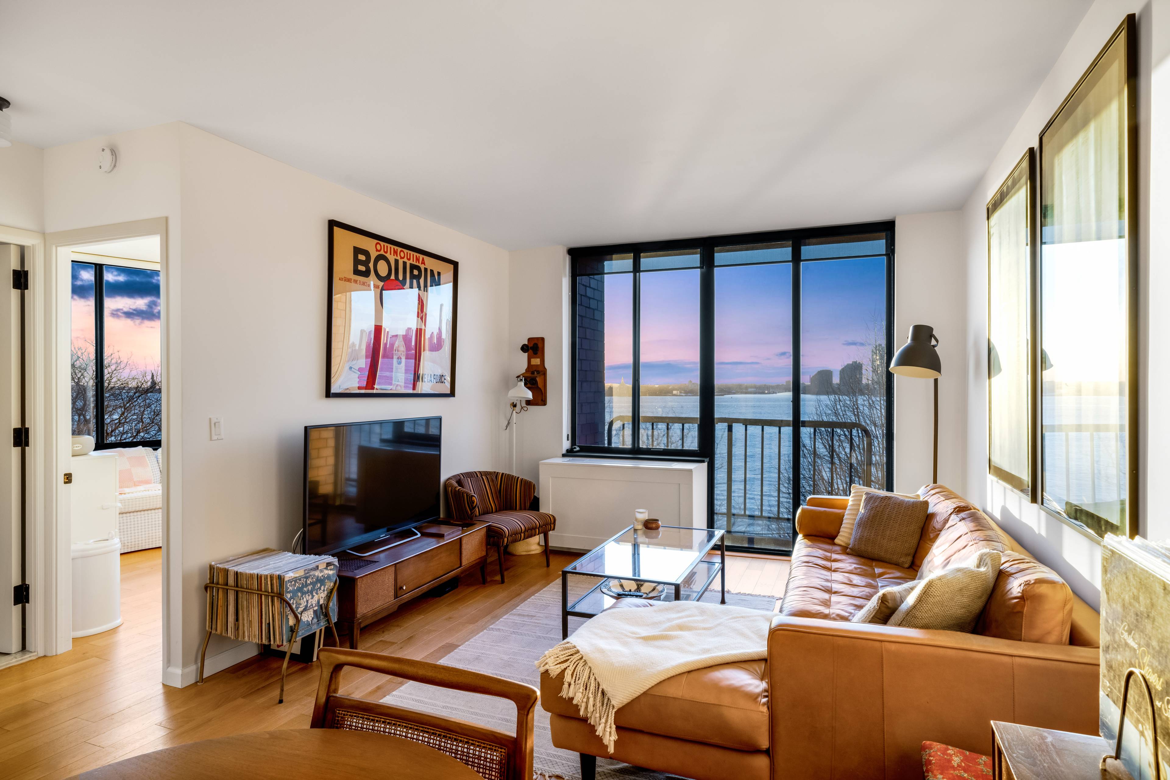 Impeccably designed and conceived light pours in through six massive windows in this exquisitely renovated, south and west facing corner apartment with Statue of Liberty and river views.