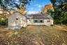 Beautifully maintained exterior with new siding and crisp trim details, showcasing a private backyard perfect for gatherings or quiet evenings at home
