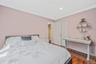 Bedroom with crown molding, dark wood finished floors, and recessed lighting
