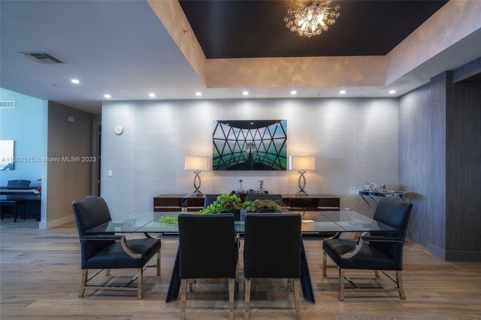 Penthouse 6 unveils an impressive 2 story layout adorned with 11' vaulted ceilings and hardwood floors, enhancing the turn key interior with expansive space.