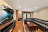 Living area featuring hardwood flooring, recessed lighting, and crown molding