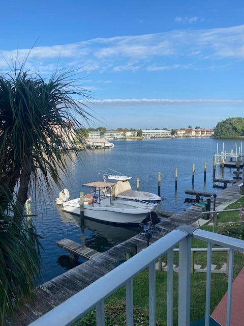 FANTASTIC DEAL Pull up and Tie up to your30Ft BOAT DOCK and enjoy your 2 Bed 2 Bath Condo with water views from your balcony priced to sell !