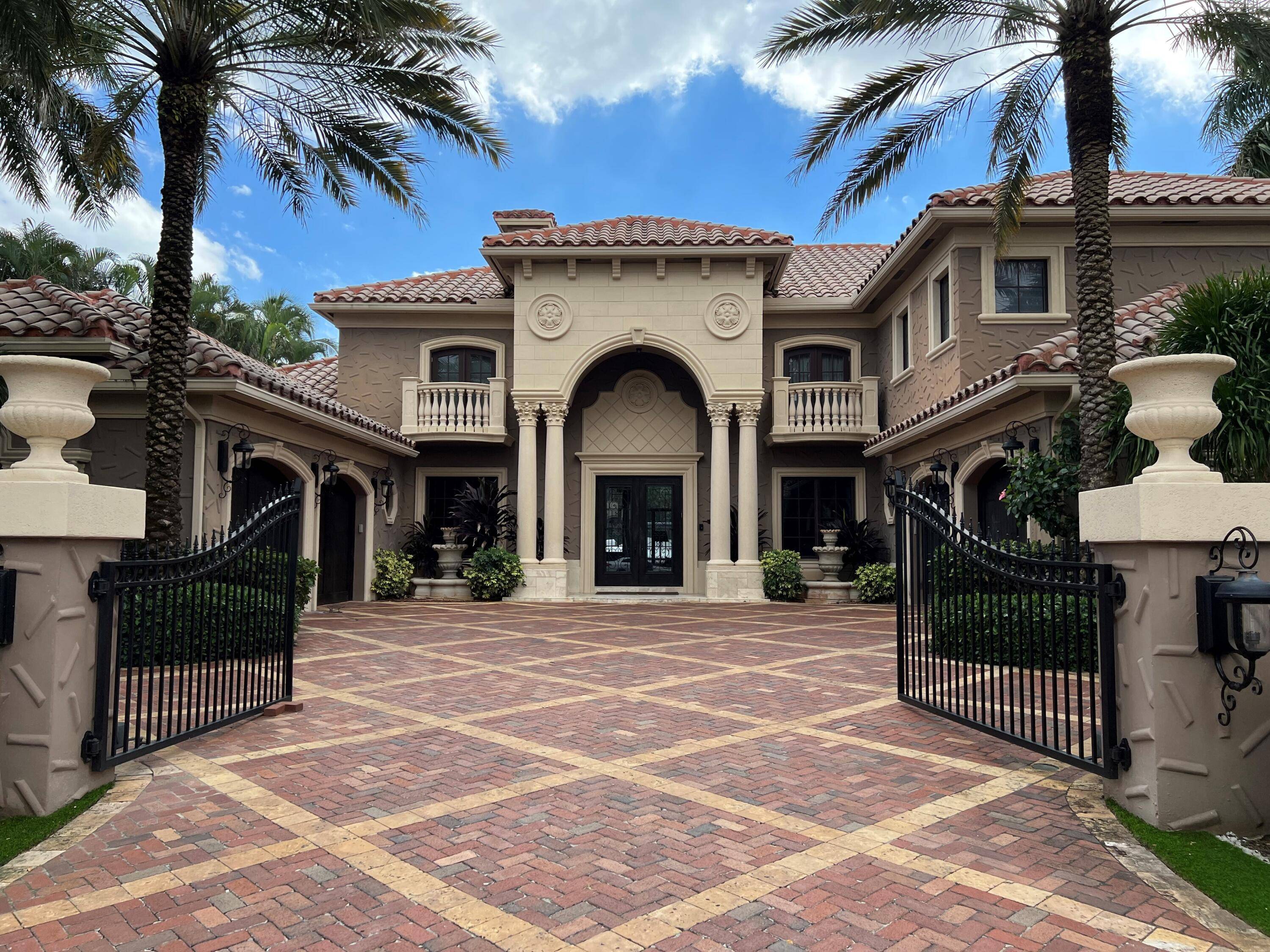 This waterfront property renovated in 2006, located in Royal Palm Yacht Country Club has 6 bedrooms, a first level Primary Suite with dual baths and wardrobes, 7.