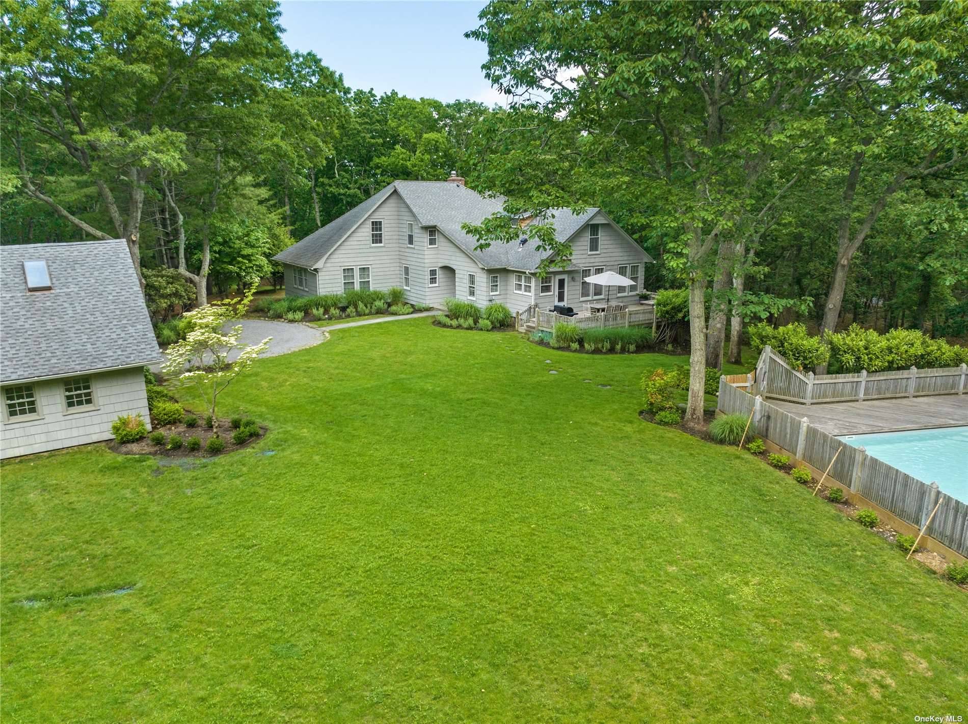 Arrive via a long private drive to this completely private country residence, minutes to the charming Village of Sag Harbor and blocks to local markets and stunning beach.