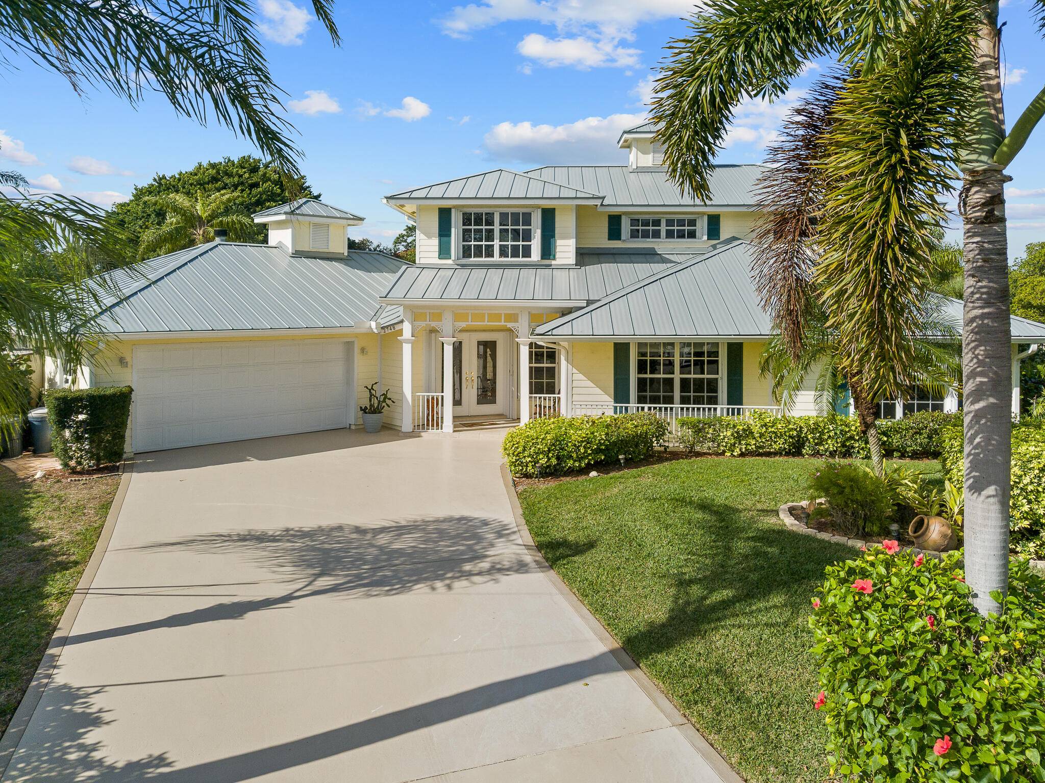 Live with dolphins and manatees in your backyard in this custom Key West style luxury home.