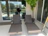 LOUNGE CHAIRS IN POOL AREA