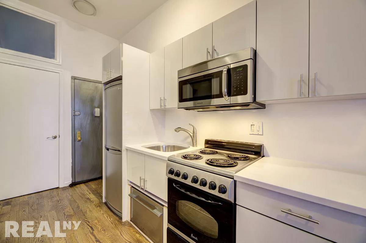 STEAL. OF. A. Deal. BEAUTIFULLY RENOVATED 2 BEDROOM IN HEART OF LOWER EAST SIDE FOR UNDER 4k !