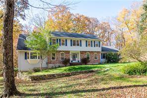 Gracious 4 Bedroom Colonial on a level, private 2 acre lot in the prestigious Weldon Woods development.