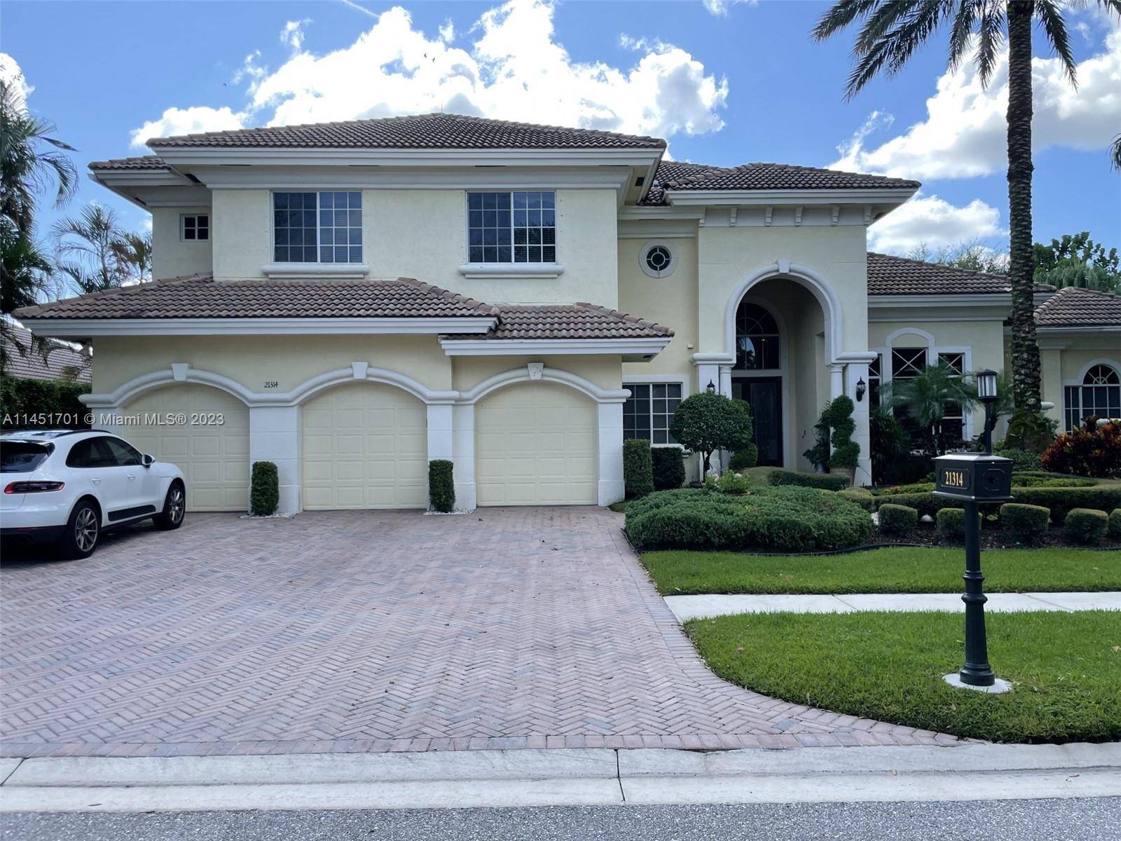 This exquisite home is situated on the sixth fairway of Boca Grove is truly one of a kind.