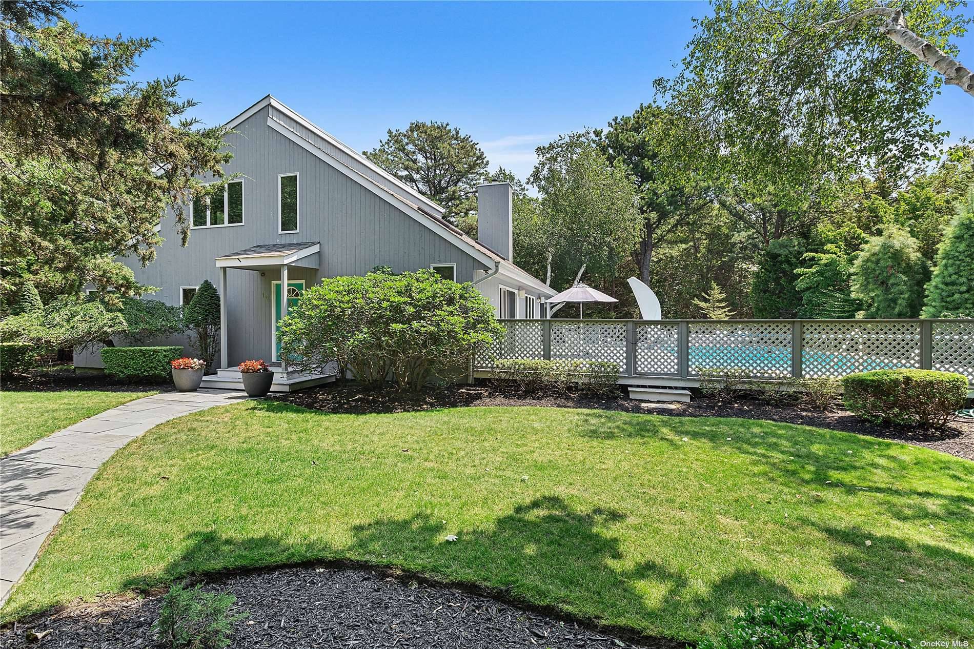 This beautiful turn key home situated on a private one acre lot, offers everything one needs in Westhampton.