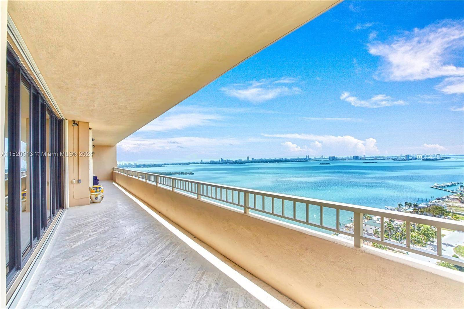 Indulge in the luxury of this completely renovated penthouse, offering breathtaking panoramic water views.