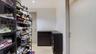 Walk in closet featuring light wood-style floors