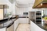 There are 2-Sinks, 2-Dishwashers, 2-Refrigerators, 2-Ovens and gas for the stove... Anyone entertaining or a gourmet will appreciate the space and th