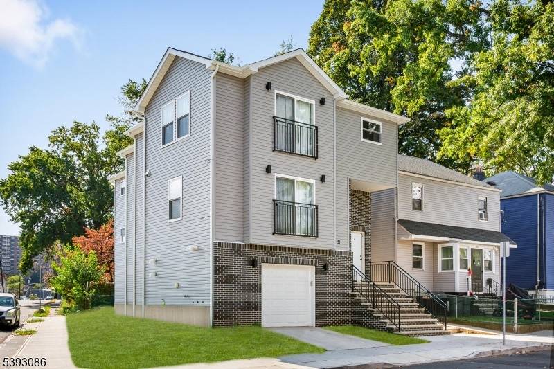 A rare find ! 33 Evergreen Ave is a modern 2 Family home with attached garage fully updated and move in ready !