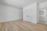 Private first floor junior primary bedroom with a full bath, ideal for guests, or a flexible office setup.