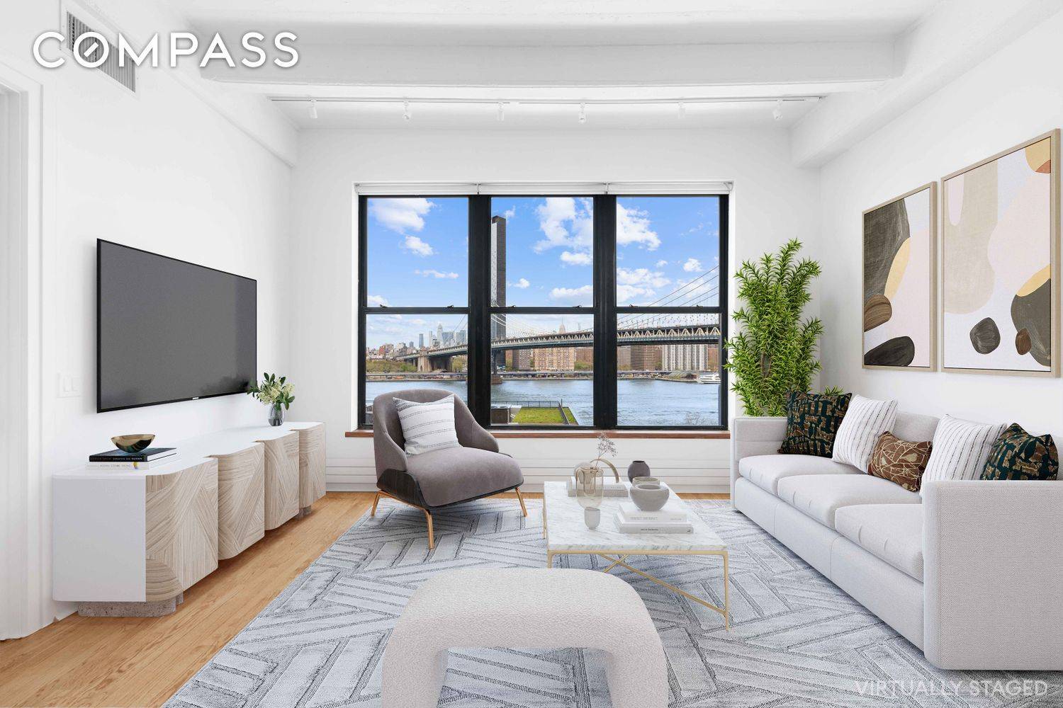 Stunning Dumbo loft with unobstructed Manhattan skyline views overlooking the Brooklyn Bridge Park and East River !