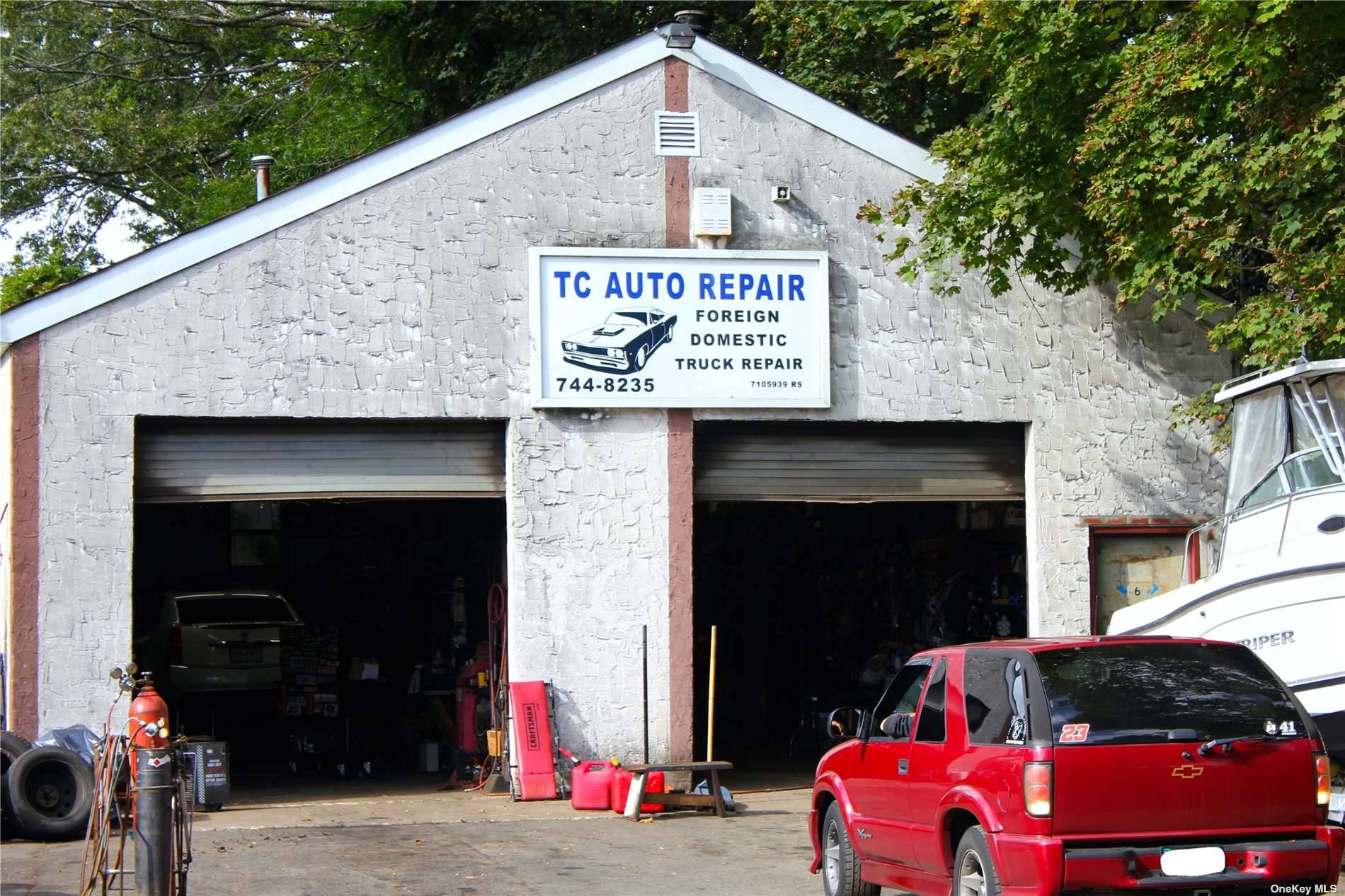 Auto Repair Shop, 1 story building with 2 garage doors.