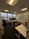 Office space with a paneled ceiling